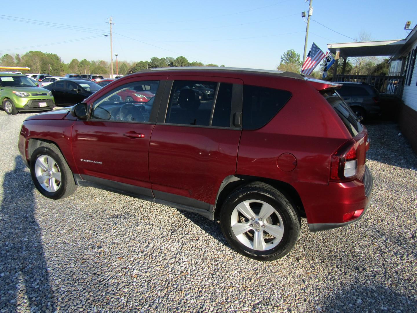 2016 Red /Gray Jeep Compass Sport FWD (1C4NJCBA3GD) with an 2.0L L4 DOHC 16V engine, Automatic transmission, located at 15016 S Hwy 231, Midland City, AL, 36350, (334) 983-3001, 31.306210, -85.495277 - Photo#5